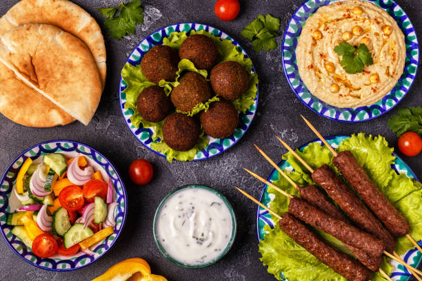 istock Classic kebabs, falafel and hummus on the plates. 934255582
