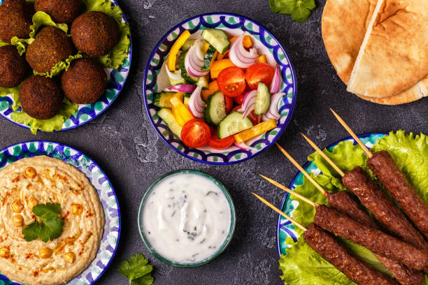 istock Classic kebabs, falafel and hummus on the plates. 934255606