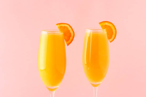 Yellow cocktail on a bright background Yellow cocktail on a bright background, selective focus. mimosa stock pictures, royalty-free photos & images