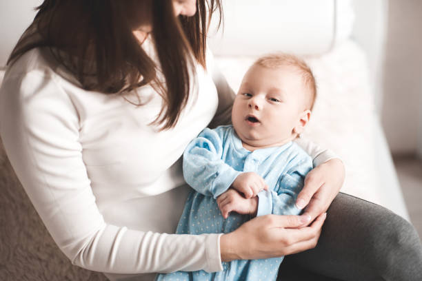 istock Mother holding baby 934259314