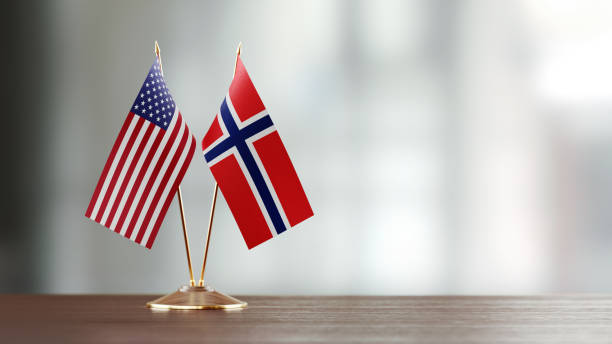 istock American And Norwegian Flag Pair On A Desk Over Defocused Background 934261646