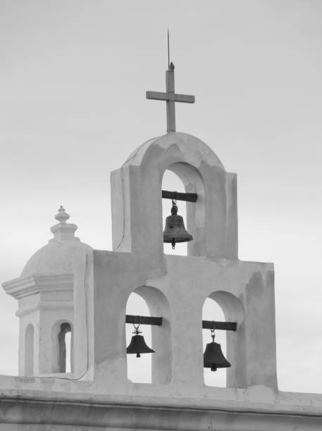 Bells of the Chapel at San Xavier del Bac Mission The San Xavier del Bac Mission stands on the Tohono O'odham Indian Reservaton near Tucson, Arizona. tohono o'odham stock pictures, royalty-free photos & images