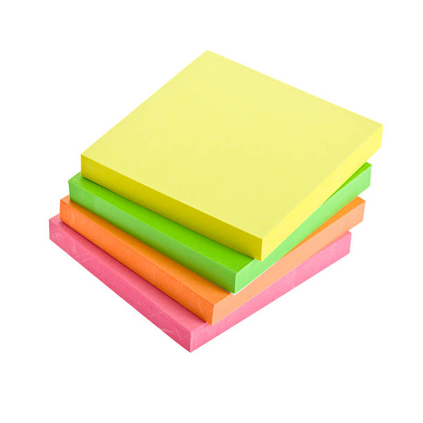 A Stack Of Four Sticky Note Pads In Different Colors Stock Photo