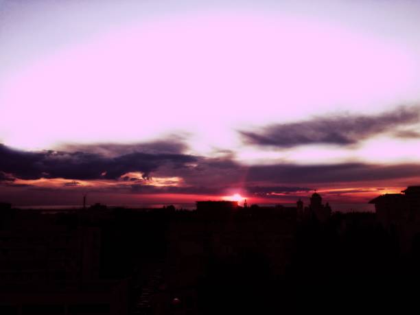 Amazing pink sky and city Bar, Montenero. Beautiful view from the terrace. Sea, clouds, sky. Perfect