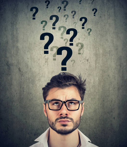 istock Man with too many questions and no answer 934271128