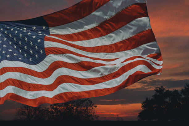 istock American flag in front of bright sky 934271434