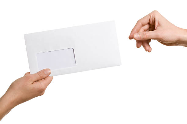 handing over an envelope. isolated on white.