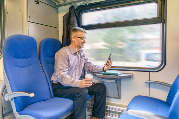 istock Businessman working and traveling by train 934273690