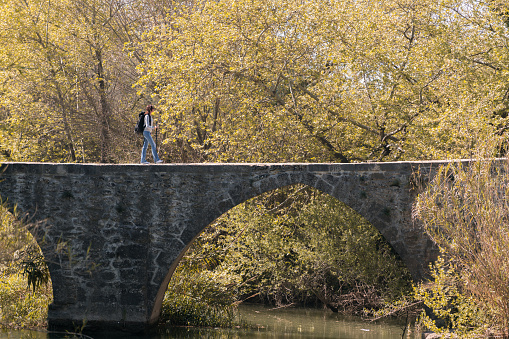 Backpacker women on the old ruin bridge