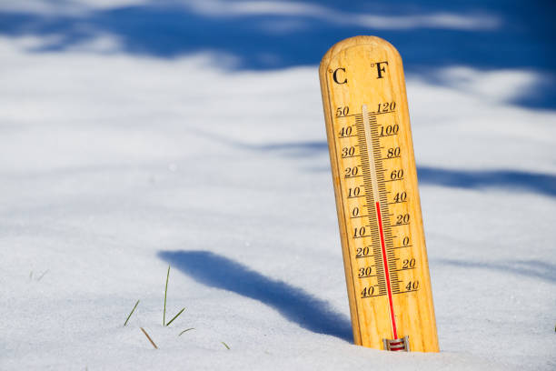 istock Thermometer in melting snow, spring is coming 934280332