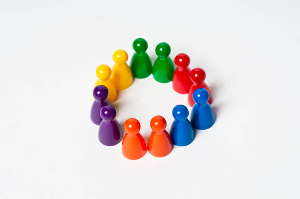 Colourful pawns making a circle Colourful pawns making a circle pawn chess piece photos stock pictures, royalty-free photos & images