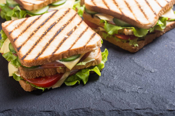 istock Club sandwich with tomatoes , cucumber , ham and cheese 934280720