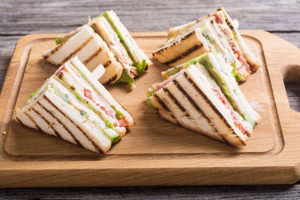istock Club sandwich with tomatoes , cucumber , ham and cheese 934280748