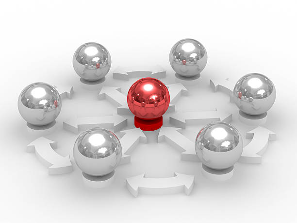 Six silver balls surrounding a red one, depicting teamwork