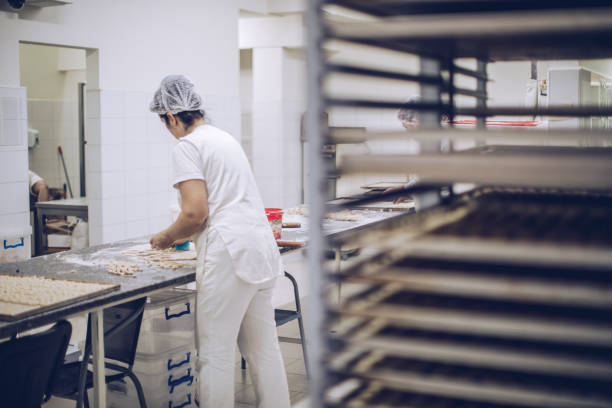istock Mature woman in bakery 934286686