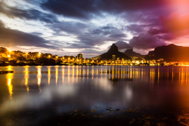 istock Lakeside view of lake during sunset, almost dark, colored light leak 934287100