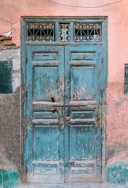 istock Very old door and cracked wall in Medina, Marrakesh 934292700