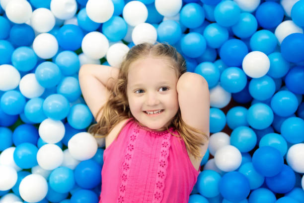 istock Kids play in ball pit. Child playing in balls pool 934295262