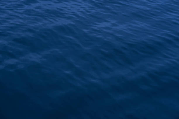 istock Surface water with ripples of blue color 934298376