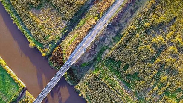 istock Aerial view of the road over a river 934298966