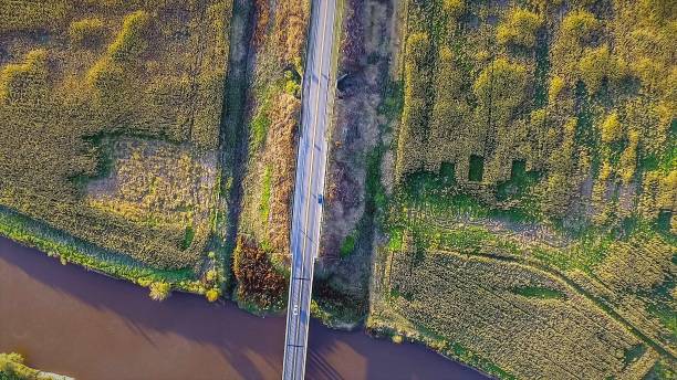 istock Aerial view of the road over a river 934298970