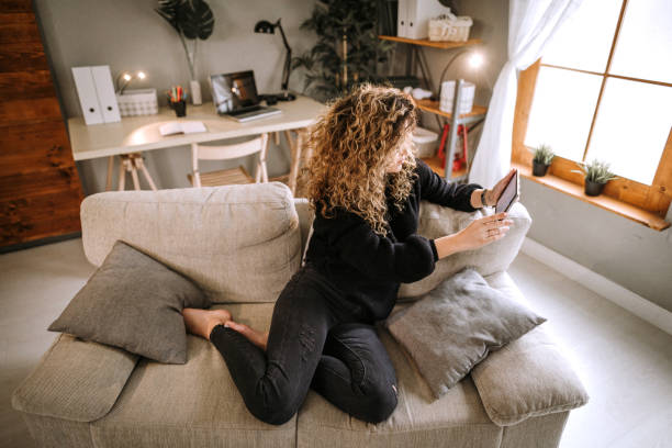 istock Young woman exploring the internet 934301674