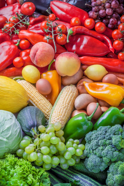 istock Vegetables and fruits fresh overhead mix large group rainbow background 934304088