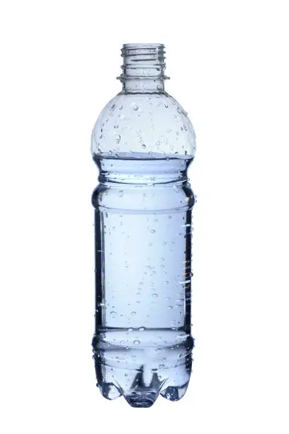 plastic bottle filled with water with water droplets isolated on white background