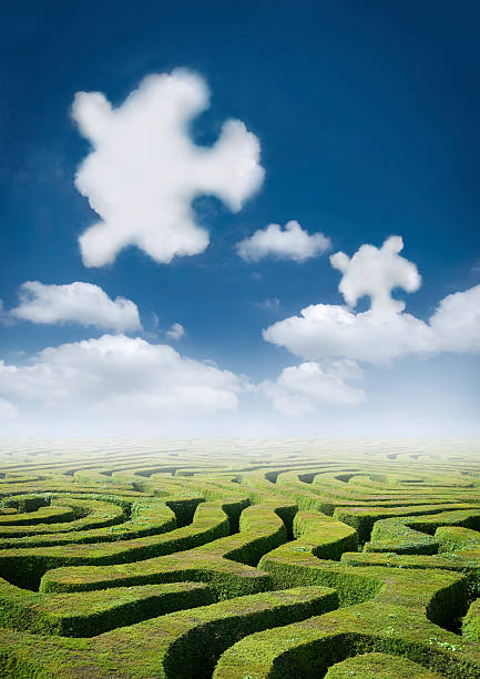 istock Green hedge maze under clouds shaped like puzzle pieces 93431337