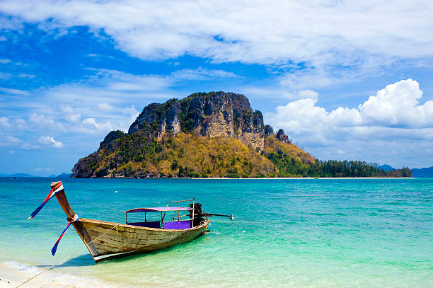 longtail boat in thailand - phuket province beach blue cliff fotografías e imágenes de stock