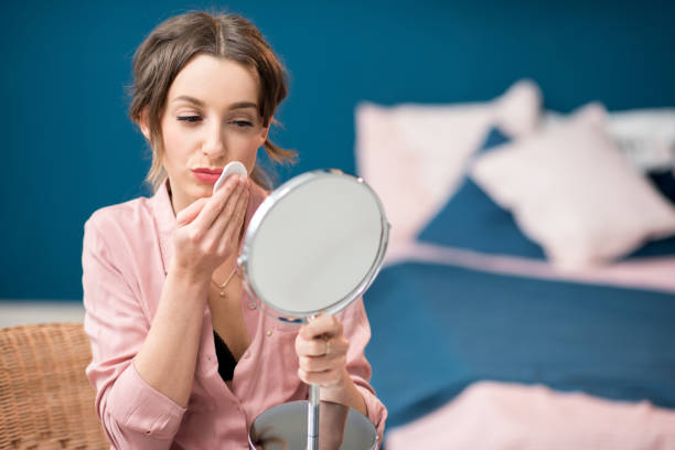 istock Woman using cotton swab indoors 934316484