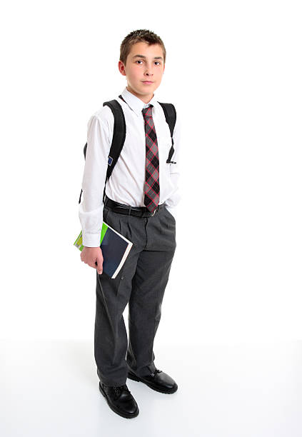 istock School student in white shirt and grey trousers. 93431786