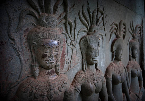 Shot in color detail on the facade of this historic building representing some character, animal or flower. Set at Siem Reap, Angkor Wat , Cambodia, Asia