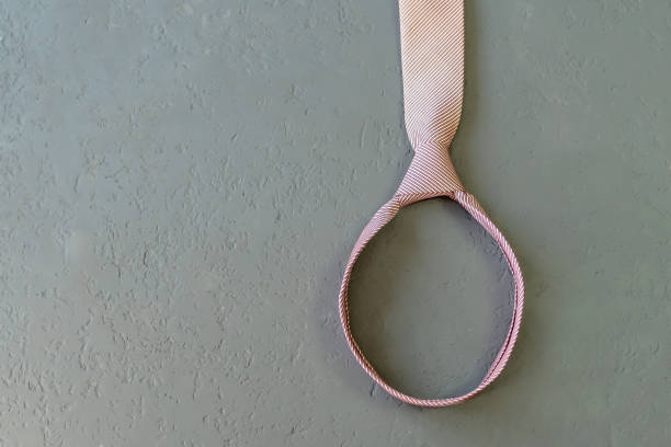 istock pink male knotted necktie, loop on a gray background 934337358