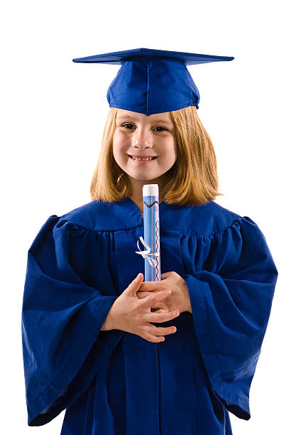 Young graduate with robe in blue stock photo