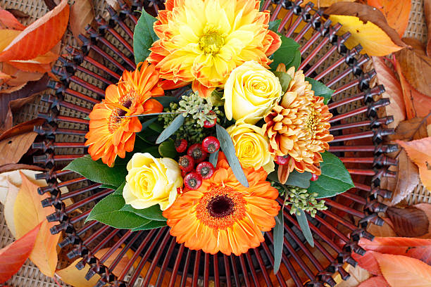 istock rose center piece for dinner table with orange gerbera daisy 93437554