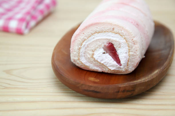 istock swiss roll on a wooden plate 934384440