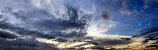 istock clouds on a background of the dark blue sky 934387462
