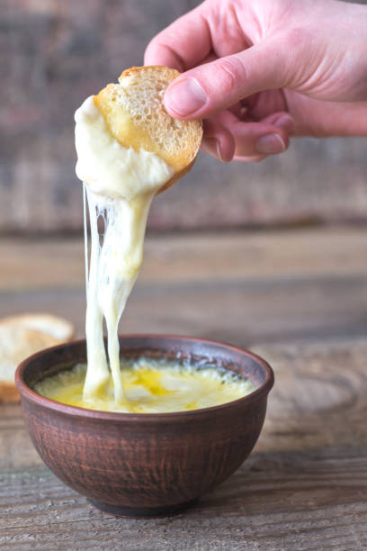 istock Bowl of cheese dip with toasts 934398530
