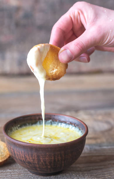 istock Bowl of cheese dip with toasts 934398618