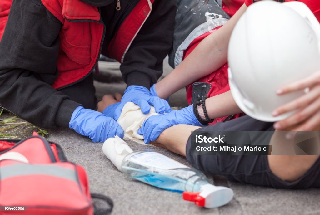 Work accident. First aid training. Arm injury. First aid after workplace accident Place of Work Stock Photo