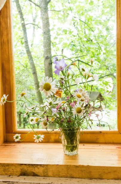 istock Homemade flowers. Still life on the windowsill. 934414786