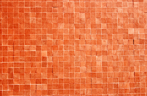 Orange ceramic wall chequered and floor tile bathroom background. Design geometric gray mosaic texture decoration bedroom. Simple seamless pattern grid for backdrop hospital wall, canteen and kitchen.