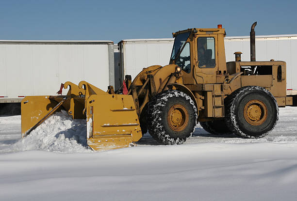 Large front end loader clearing snow after a storm  large letter a stock pictures, royalty-free photos & images