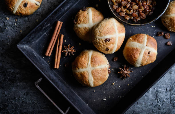 istock Hot Cross Buns - Easter sweet spiced pies with raisins 934428416