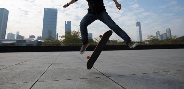 istock Skateboarder jumping on city stairs with skateboard 934437138