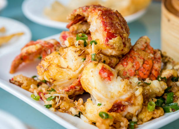 Salt and pepper deep fried lobster pieces stock photo
