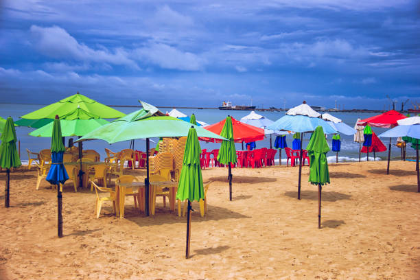 istock Elegant umbrellas and tables on the beach. 934439240