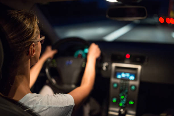 istock Female drive driving a car at night 934441820