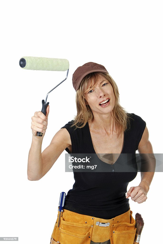 Angry feminino pintor Acenando um Rolo para Pintar Paredes - Royalty-free 40-44 anos Foto de stock
